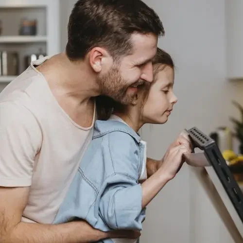 father-daughter-making-cookies